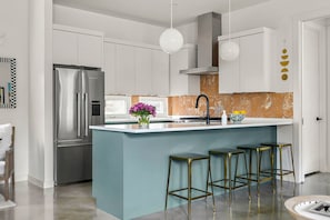 Prepare delicious meals with ease in this fully equipped kitchen.
