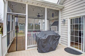 Screened-in porch and propane barbecue.