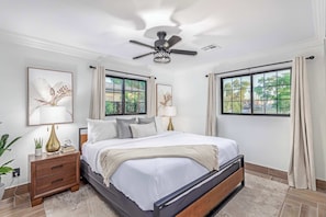 Master bedroom with King bed, ceiling fan and en-suite bathroom