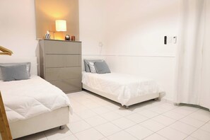 Bright, airy, and spacious, this room offers two beds for a restful night's sleep.