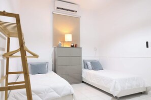 Two beds, one peaceful retreat — the ideal spot for relaxation and rest.