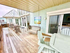 Relax on our porch swing watching the dolphins swim by