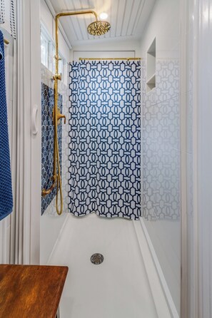 Custom tiled shower with elegant fixtures
