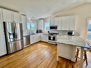 Kitchen with brand new GE Cafe appliances