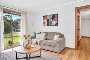 A second living area offers a sofa and TV to ensure everyone is comfortably accommodated.
