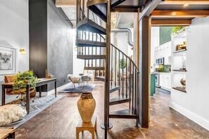 Staircase to loft bedroom with Cloud king bed