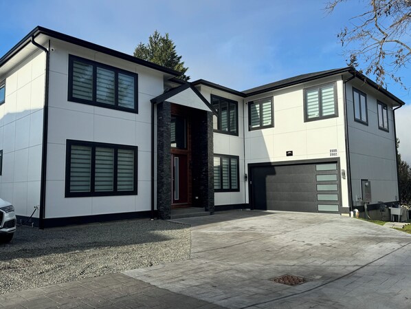 Main house but renting unit is located on top of garage 