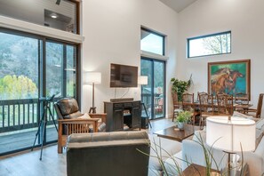 Main Living Area | Flat-Screen TV | Wood-Burning Stove | 1st Floor