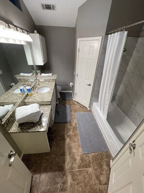Master Bath has 2 walk in closets, and 1 shoe/ linens closet