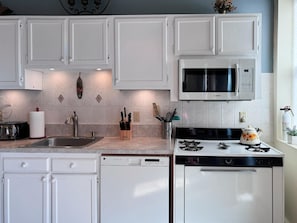 Full kitchen apartment # 4 : blender , toaster oven, microwave, silverware, can opener , etc.
