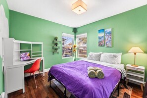 Bedroom 2 has a comfy queen bed and night stand