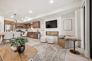 The electric fireplace adds a warm ambiance and a gentle glow.