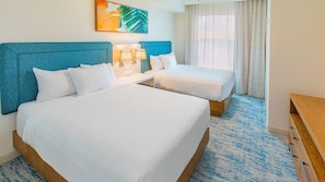 Bright and spacious bedroom with plush bedding, ideal for a restful and cozy stay.