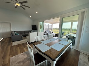 Grand family room and dining area with unobstructed view of Prime Hook Refuge