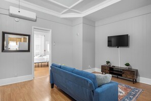Comfortable Seating for Relaxation
Sink into the plush blue sectional sofa, complete with throw pillows and blankets for your comfort after a long day of exploring.