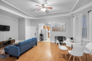Bright and Airy Space
Natural and soft lighting enhances the open feel of the room, complemented by elegant crown molding and neutral walls.