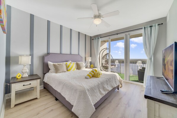 Master bedroom with King bed and balcony access overlooking Lake Bryan.