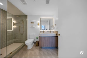 Primary bathroom: walk-in shower with a bench