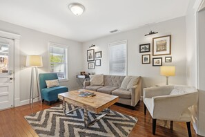 Living Room: Relax in the spacious living room, featuring a cozy sofa and a smart TV for your entertainment.