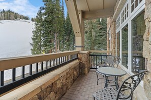 Private balcony with outdoor seating with up-close views of the slopes.