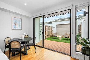 Dining area with enough seating for all guests with direct access to the backyard.