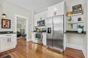 The quaint kitchen offers ample space & all the comforts of home