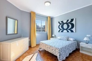 Bright and modern master bedroom with a comfortable double bed and storage area. (1)