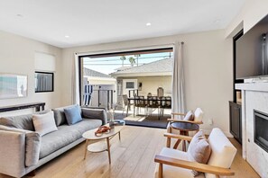 Main lower level living room - vanishing sliders for indoor/outdoor living