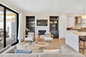 Beautifully designed, flat screen tv mounted above gas fireplace