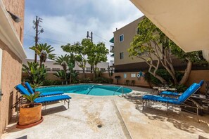Step outside to take a dip in the communal pool.