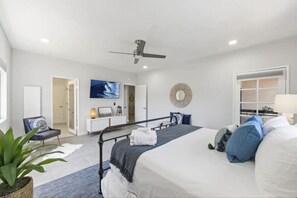 Master Bedroom king bed with en-suite master bathroom and mounted TV