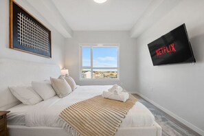 55" Smart TV with Netlix in the Master Bedroom. King size bed and an ensuite bathroom.