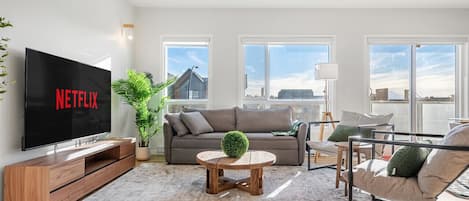 This 2 Bedroom + Queen Sofa Bed offers tons of natural light.
