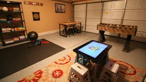 Game room with Infinity table, foosball, darts, poker/game table and exercise 
