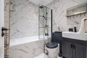 The main bathroom, located on the ground floor, has the benefit of having a bath with a shower, toilet and sink. 
We provide toilet rolls, bath matts and towels.