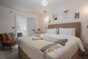 Here is the beautiful upstairs bedroom that has a super king bed.
The attached bathroom is an added bonus! No need to go downstairs to the main bathroom when you have one attached to your bedroom.