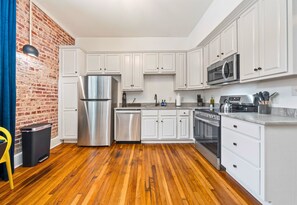 A fully equipped kitchen with stainless steel appliances and plenty of counter space, perfect for preparing meals or snacks during your stay.