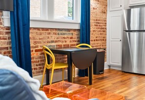 This bright dining nook, with sleek modern chairs and plenty of natural light, is an ideal spot to enjoy meals or sip your morning coffee.
