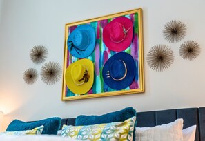 Eye-catching artwork and unique decor make this loft feel like a stylish retreat, adding personality and charm to every corner.