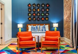 Pops of color and retro-inspired seating create a fun and inviting living space that’s perfect for relaxing or planning your next adventure.