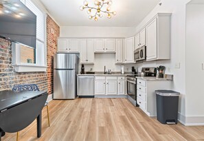 A stylish and fully equipped kitchen with stainless steel appliances and plenty of room to prepare meals during your stay.