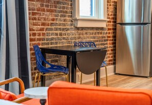 This dining nook offers a cozy corner for meals or morning coffee, with chic seating and natural light that sets the perfect mood.