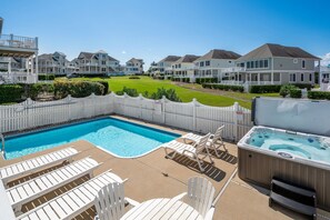 Pool area overlooks the open space behind the house for a more private relaxing getaway