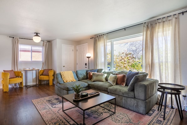 Cozy living room vibe with sunlit windows