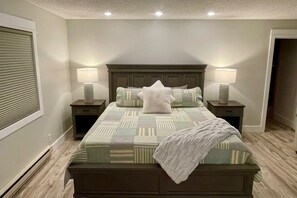 Bedroom 1, king bed, private bathroom, walk-in closet, twin sleeper couch, TV