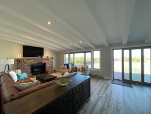 Expansive living with views to the back patio and ocean