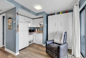 Compact kitchen with cozy charm.