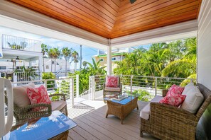 New balcony overlooks gulf & our pool! Beautiful wood cathedral ceiling & fan!