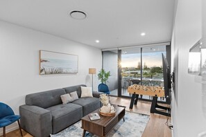 Stylishly designed living room featuring a modern electric sofa bed for extra comfort.
