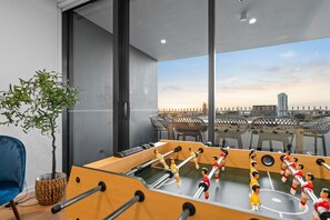 Unwind with a friendly game on the soccer table, perfect for family and friends